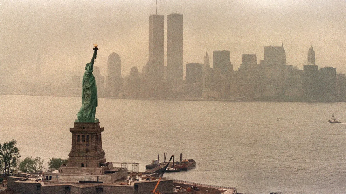 A picture taken 20 May 1986 in New York shows the Statue of Liberty and the Twin Towers of the World Trade Center in the background. The Twin Towers collapsed 11 September 2001 after being damaged by two hijacked planes. AFP PHOTO MARIO SURIANI (Photo by AFP)