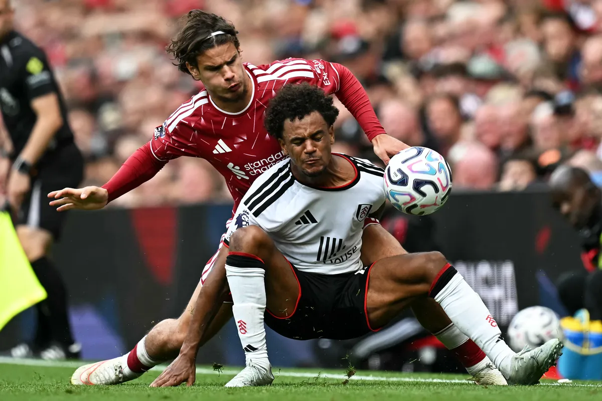 Liverpool's Hungarian defender #06 Milos Kerkez (L) vies with Fulham's Norwegian midfielder #14 Oscar Bobb (R) during the English Premier League football match between Liverpool and Fulham at Anfield in Liverpool, north west England on September 12, 2026. (Photo by Paul ELLIS / AFP) / RESTRICTED TO EDITORIAL USE. No use with unauthorized audio, video, data, fixture lists, club/league logos or 'live' services. Online in-match use limited to 120 images. An additional 40 images may be used in extra time. No video emulation. Social media in-match use limited to 120 images. An additional 40 images may be used in extra time. No use in betting publications, games or single club/league/player publications. / 
