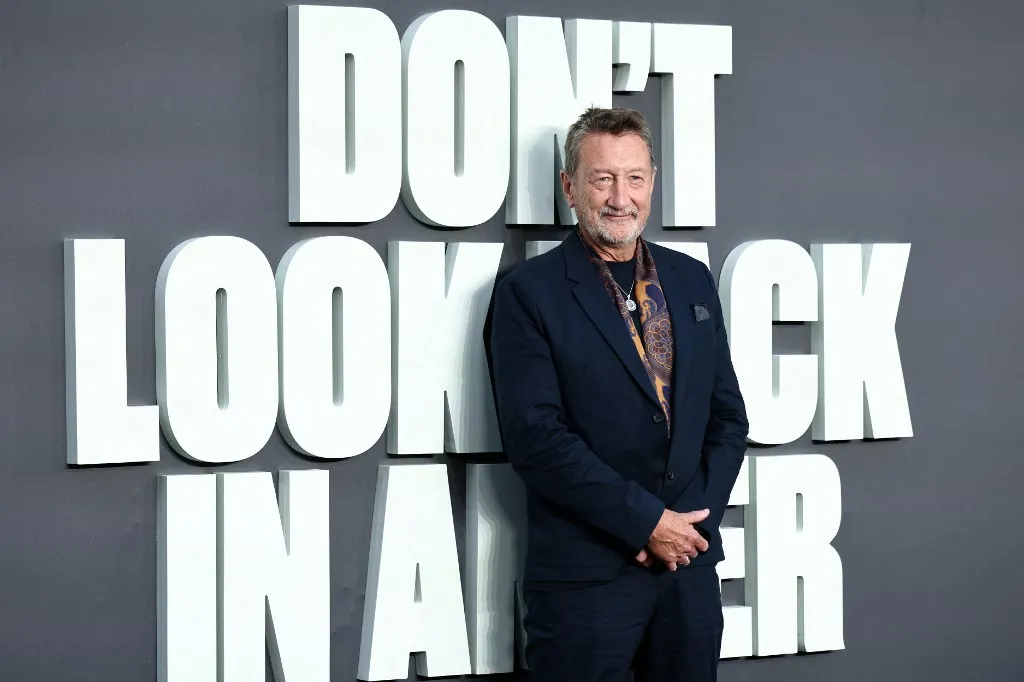 English screenwriter Steven Knight poses upon arrival on the red carpet for the UK premiere of the film 'Oasis: Don't Look Back In Anger', in Leicester Square in central London on September 7, 2026. (Photo by Henry NICHOLLS / AFP)