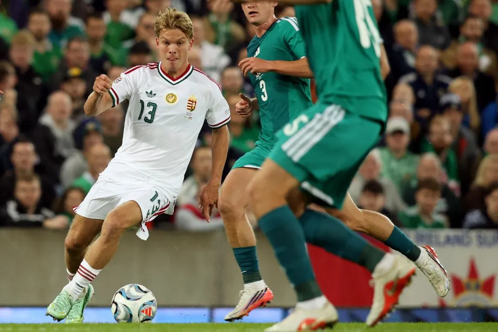 Hungary's midfielder #13 Andras Schafer (L) runs with the ball during the UEFA Nations League, League B, Group 2 match between Northern Ireland and Hungary at Windsor Park in Belfast, Northern Ireland on September 28, 2026. (Photo by Paul Faith / AFP)