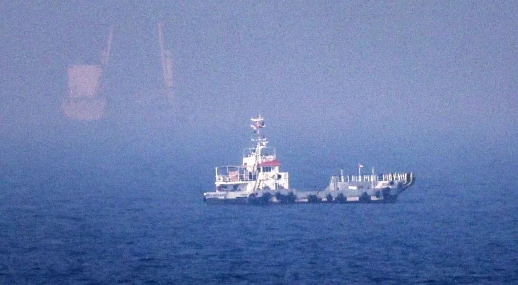 This picture shows ships sailing near the Strait of Hormuz off the eastern coast of the United Arab Emirates at Khor Fakkan on July 13, 2026. The United States is "taking over" the Strait of Hormuz and will be paid for protecting it, US President Donald Trump declared on July 13, as Washington and Tehran once again fought over the vital waterway. (Photo by AFP) / 