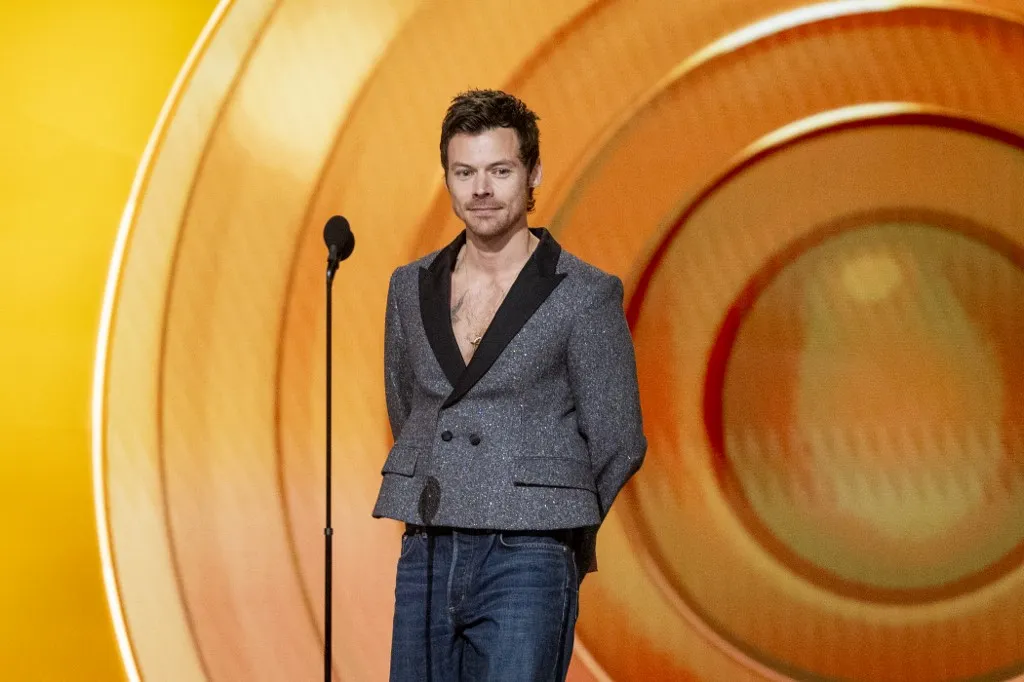 LOS ANGELES, CALIFORNIA - FEBRUARY 01: Harry Styles speaks onstage during the 68th GRAMMY Awards at Crypto.com Arena on February 01, 2026 in Los Angeles, California. Emma McIntyre/Getty Images for The Recording Academy/AFP (Photo by Emma McIntyre / GETTY IMAGES NORTH AMERICA / Getty Images via AFP), Harry Styles