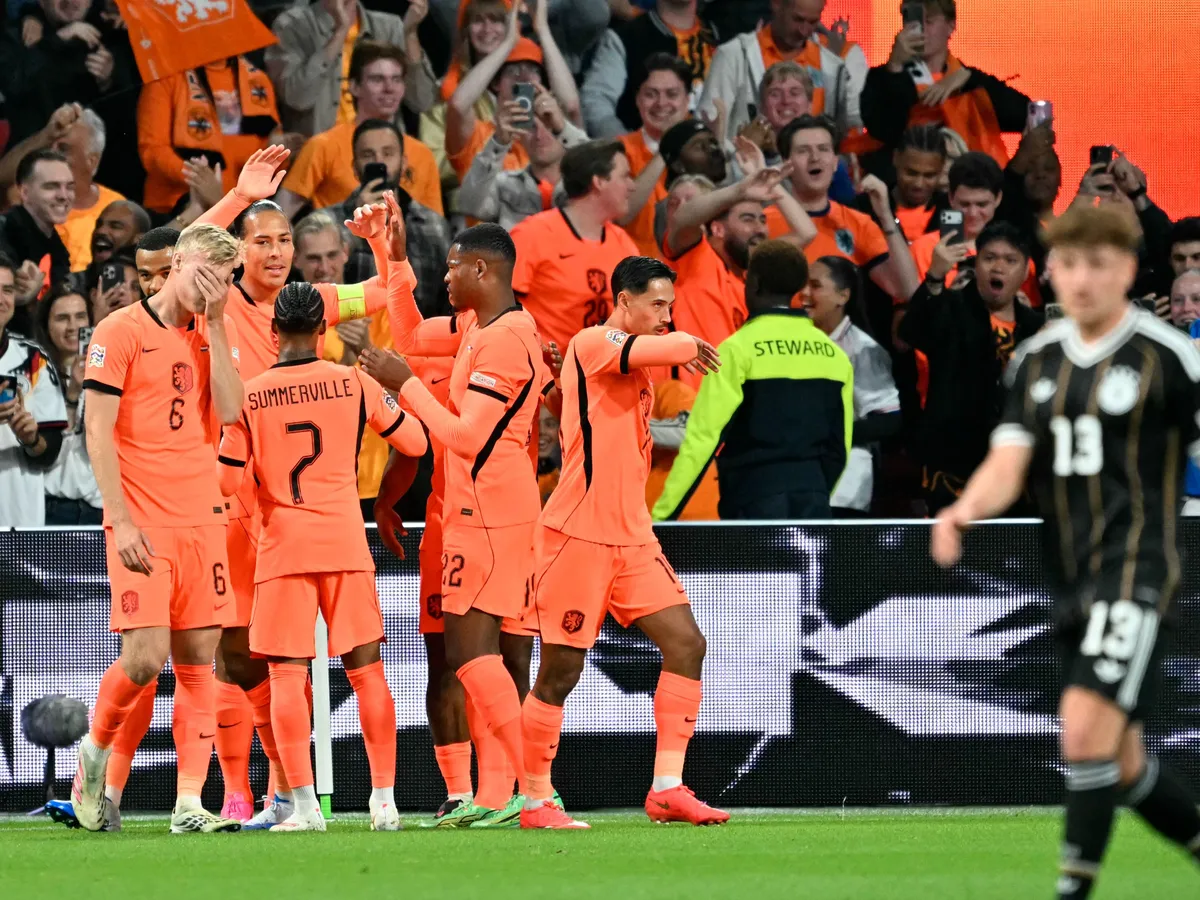Netherlands' defender #04 Virgil van Dijk (C) celebrates with teammates after scoring his team's first goal during the UEFA Nations League (League A, Group A2) football match between Netherlands and Germany at Johan Cruijff ArenA in Amsterdam on September 24, 2026. (Photo by NICOLAS TUCAT / AFP)