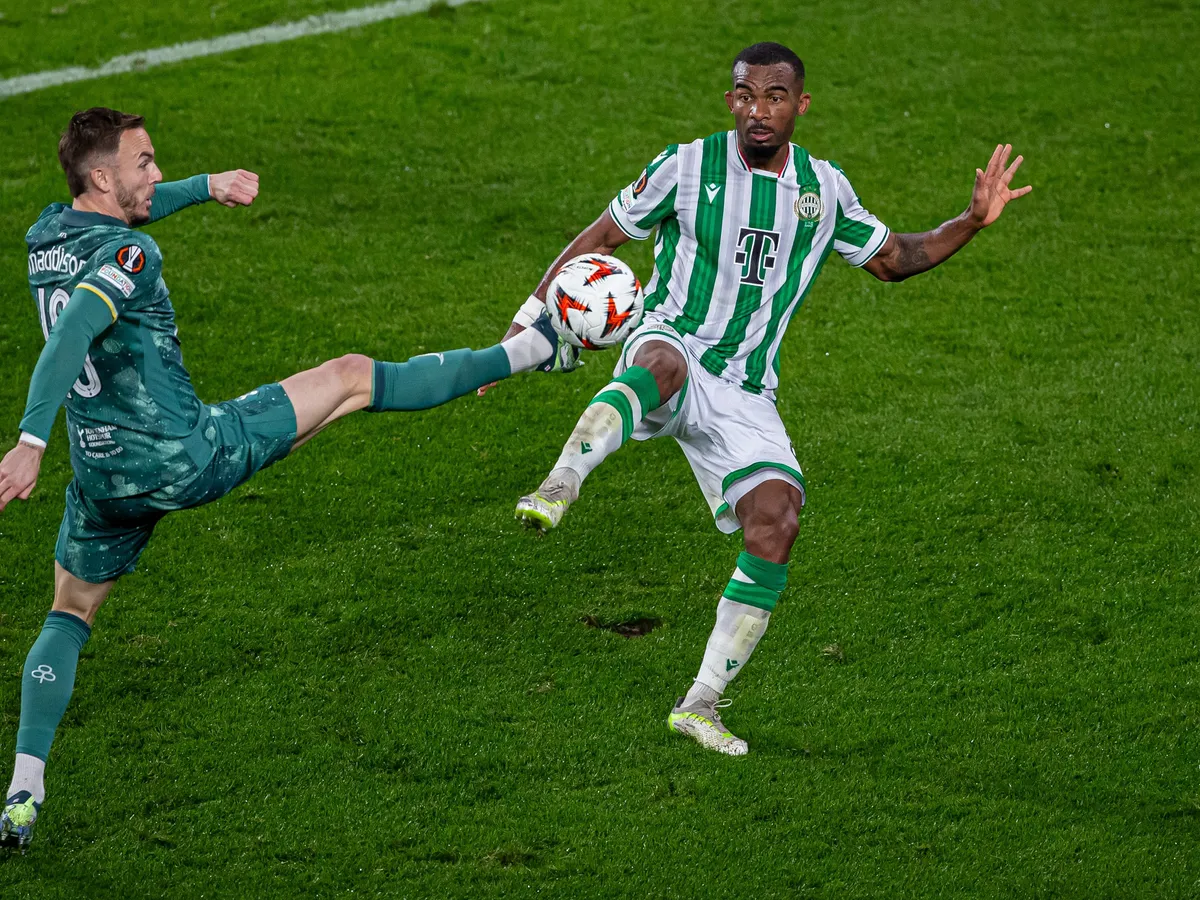 James Maddison of Tottenham competes for the ball with Habib Maiga of FTC during the UEFA Europa League match at Groupama Arena in Budapest, Hungary, on October 3, 2024. (Photo by Robert Szaniszlo/NurPhoto) (Photo by Robert Szaniszlo / NurPhoto via AFP)