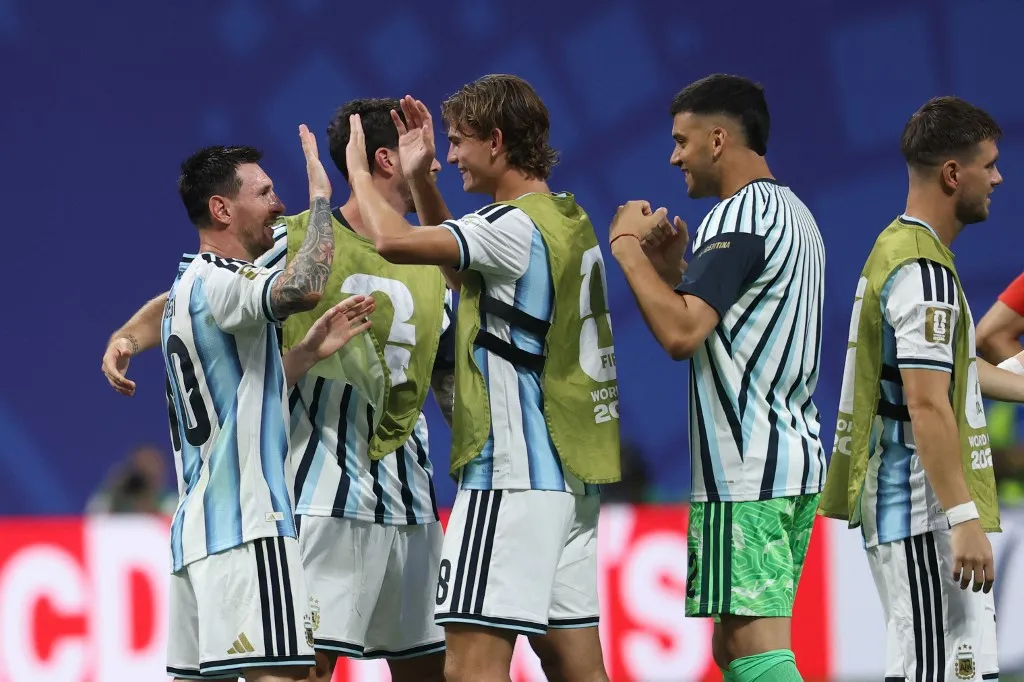 Argentina's forwards #10 Lionel Messi and #18 Nico Paz celebrate after winning the 2026 World Cup round of 16 football match between Argentina and Egypt at Atlanta Stadium in Atlanta on July 7, 2026. (Photo by Odd ANDERSEN / AFP)