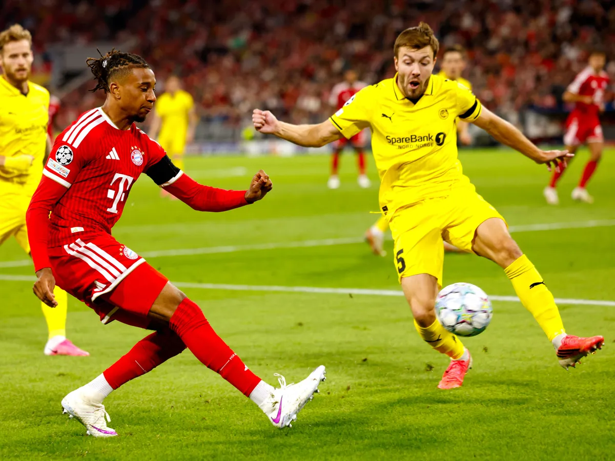 Bayern Munich's French midfielder #17 Michael Olise and Bodo/Glimt's Norwegian defender #15 Fredrik Andre Bjorkan fight for the ball during the UEFA Champions League football match between FC Bayern Munich and Bodo/Glimt at the Allianz Arena Stadium in Munich on September 10, 2026. (Photo by Michaela STACHE / AFP)