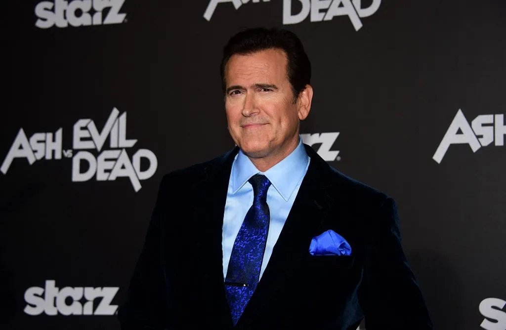 From the cast, actor Bruce Campbell poses on arrival for the Los Angeles premiere of "Ash vs Evil Dead" in Hollywood, California on October 28, 2015. The television series premieres on October 31. AFP PHOTO/ FREDERIC J. BROWN (Photo by FREDERIC J. BROWN / AFP)