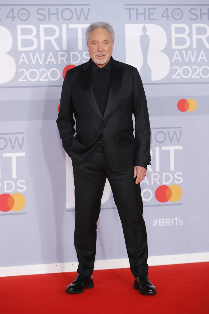 British singer Tom Jones poses on the red carpet on arrival for the BRIT Awards 2020 in London on February 18, 2020. (Photo by Tolga AKMEN / AFP) / RESTRICTED TO EDITORIAL USE NO POSTERS NO MERCHANDISE NO USE IN PUBLICATIONS DEVOTED TO ARTISTS