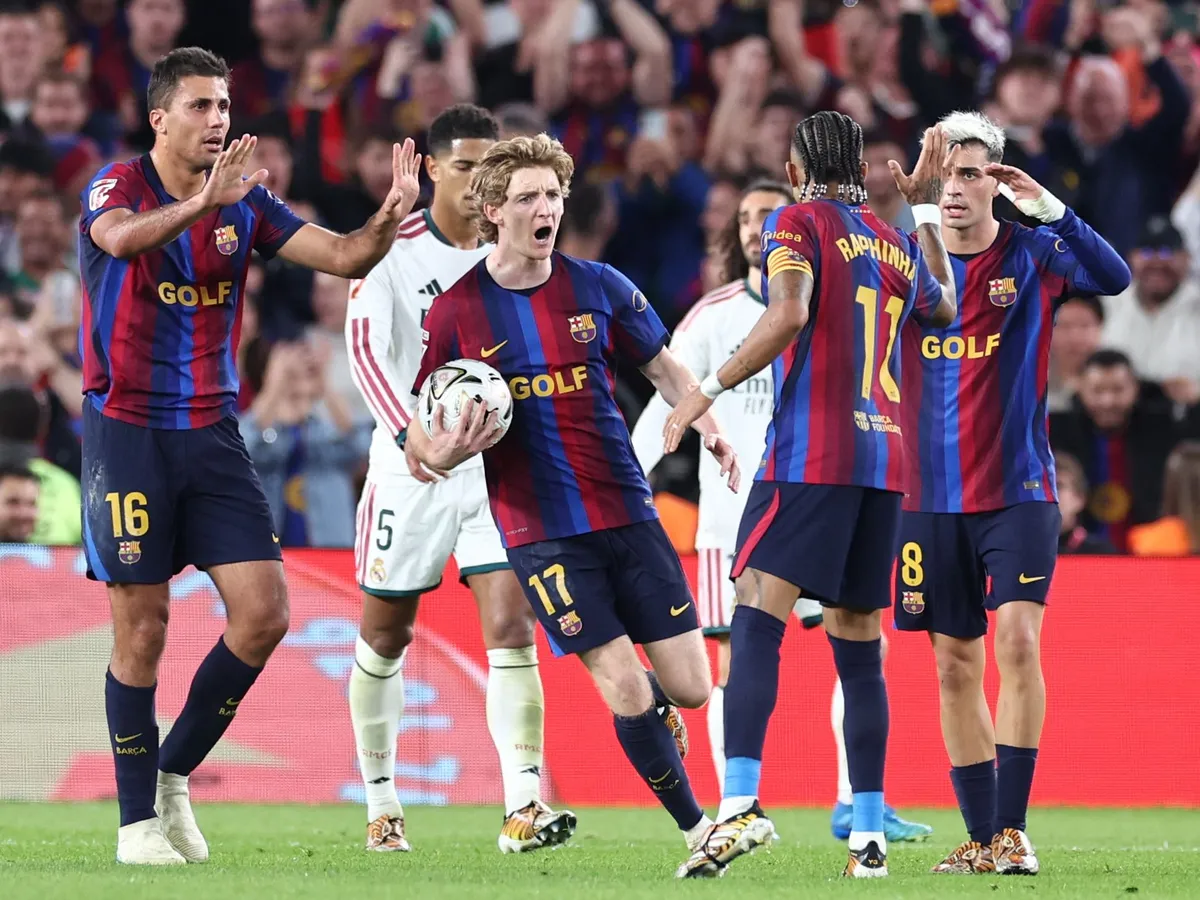 Barcelona's Brazilian forward #11 Raphinha celebrates scoring his team's first goal with teammates during the Spanish league football match between FC Barcelona and Real Madrid CF at Camp Nou Stadium in Barcelona on October 25, 2026. (Photo by Josep LAGO / AFP)
