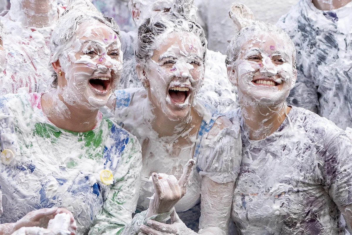 Students take part in the traditional Raisin Monday foam fight on St Salvator's Lower College Lawn at the University of St Andrews in Fife. The messy display is the culmination of a weekend of festivities where first years say thank you to their more senior student "parents" for mentoring them. Picture date: Monday October 19, 2026., habcsata