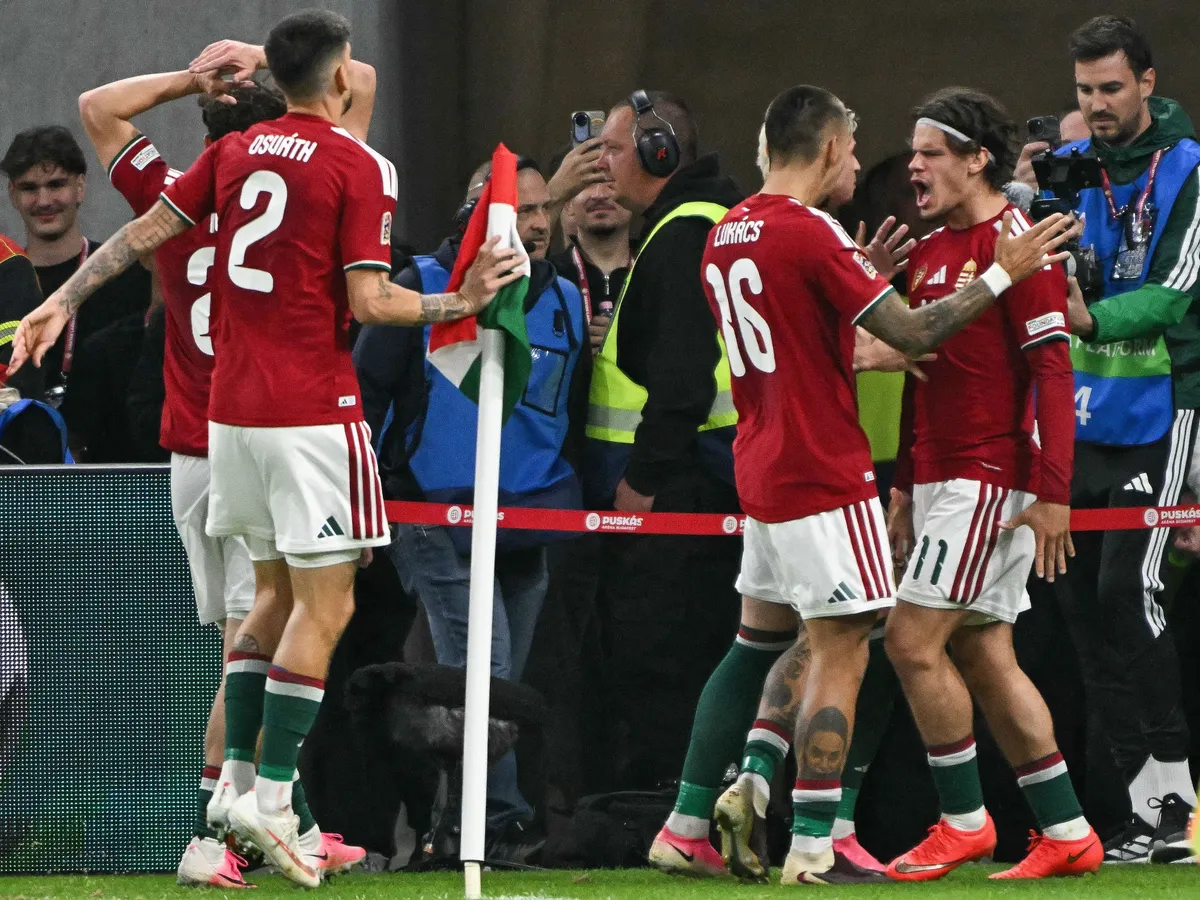 Hungary's midfielder #11 Milos Kerkez (R) celebrates scoring the opening goal with his teammates including Hungary's forward #16 Daniel Lukacs during the UEFA Nations League Group B2 football match between Hungary and Georgia at the Puskas Arena in Budapest, Hungary on October 2, 2026. (Photo by Attila KISBENEDEK / AFP)